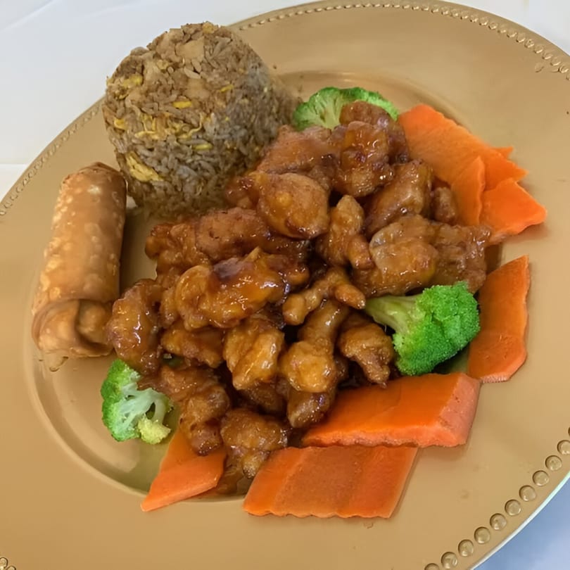 Golden Phoenix Chinese Restaurant's General Tso's chicken with fried rice, an egg roll, broccoli, and carrots.